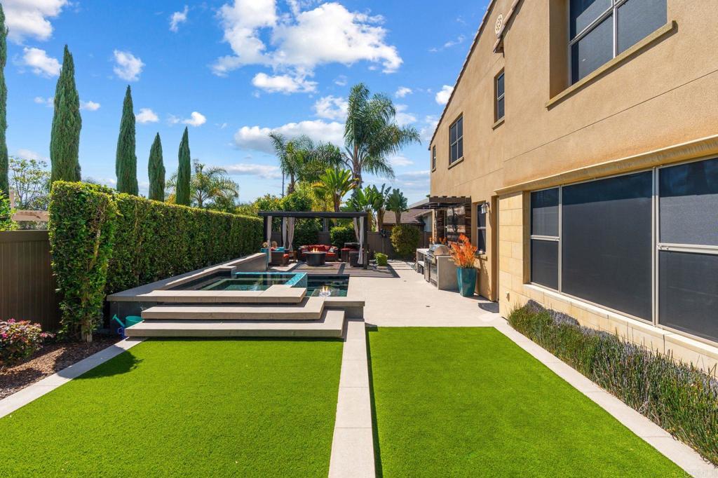 809 Dolphin Circle Encinitas, CA 92024 - Photo 9 of 71 a view of a patio with chairs and a yard