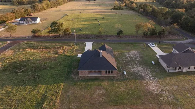 a view of a swimming pool with a yard