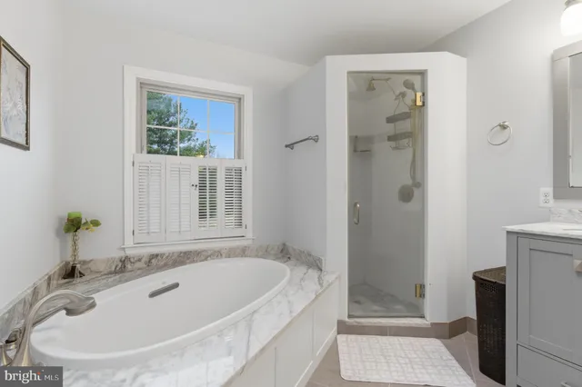 a bathroom with double sink and a mirror