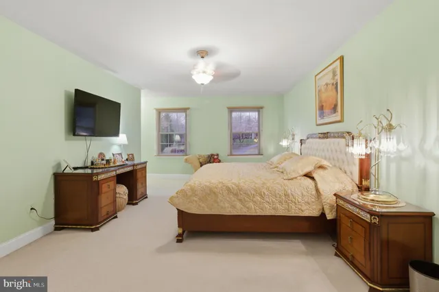 a spacious bedroom with a bed and a couch