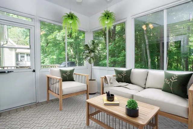 a living room with furniture and a large window