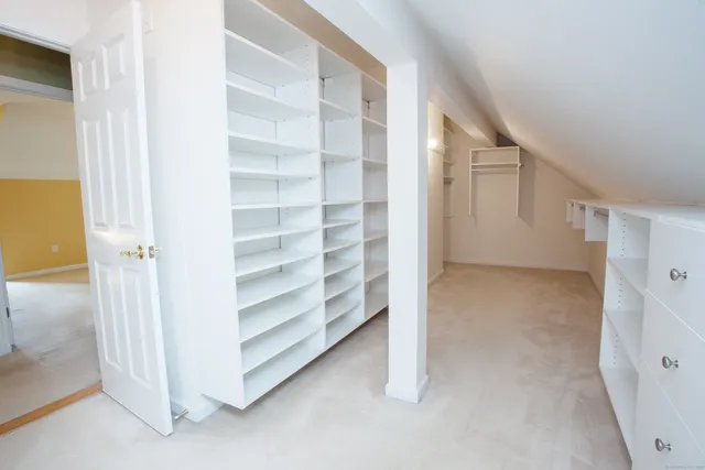 a view of an empty room and entryway