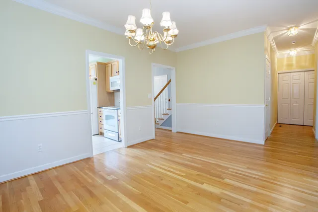 an empty room with fireplace and window