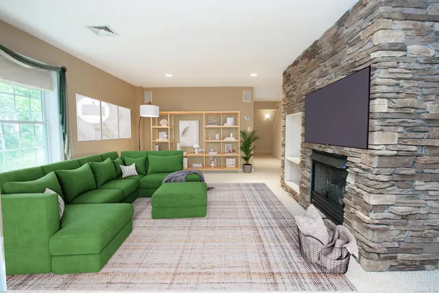 a living room with furniture and a fireplace