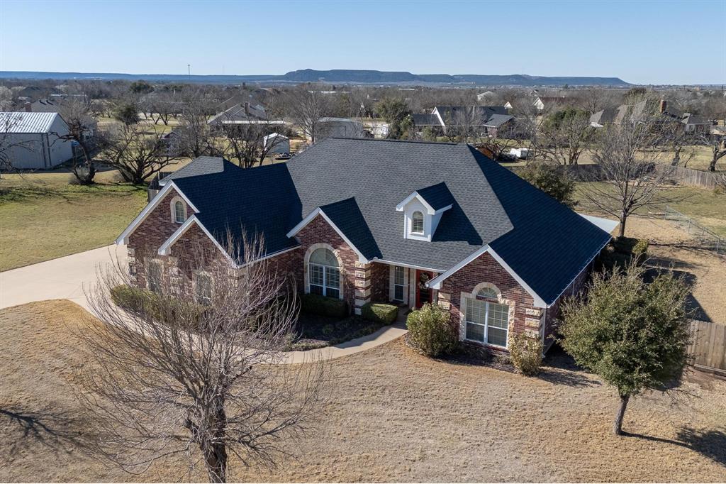 Welcome to 150 Prairie Star Road. Cul-de-sac living with an extended driveway & parking pad, side load 2-car garage with extended depth & extra storage closet. 2,700 square feet, Drop zone, 1st floor main suite, separate laundry-room  with sink & storage, privacy fence, brick exterior, sprinkler system, landscaping, and exspansive yard on 1.2 acres.