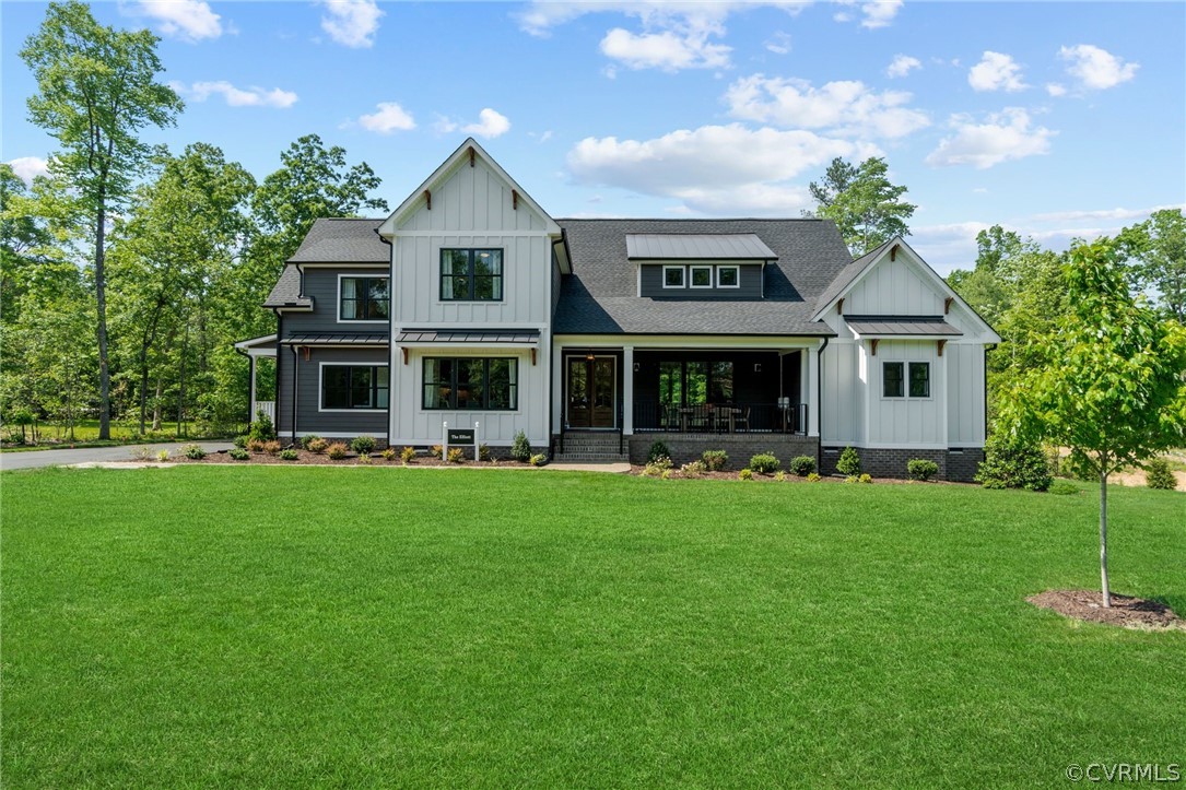 9440 Wickham Crossing Way Ashland, VA 23005 - Photo 1 of 26 a front view of a house with a garden