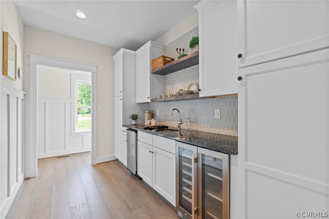 9440 Wickham Crossing Way Ashland, VA 23005 - Photo 12 of 26 a kitchen with stainless steel appliances granite countertop a sink and cabinets