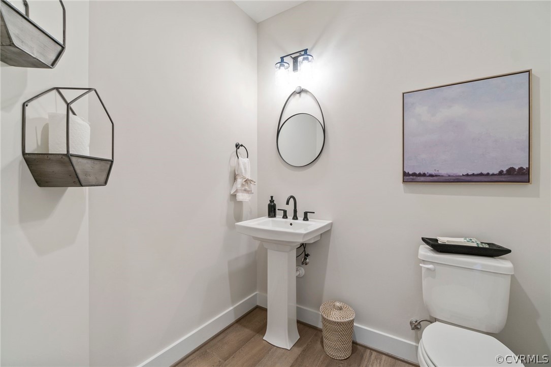 9440 Wickham Crossing Way Ashland, VA 23005 - Photo 14 of 26 a bathroom with a toilet a sink and mirror