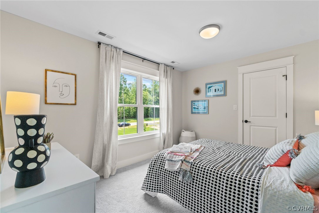 9440 Wickham Crossing Way Ashland, VA 23005 - Photo 17 of 26 a bedroom with a bed and a window