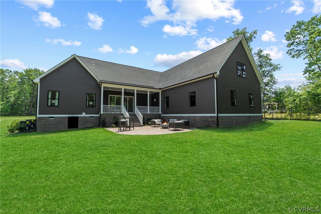 9440 Wickham Crossing Way Ashland, VA 23005 - Photo 25 of 26 a front view of house with yard and outdoor seating