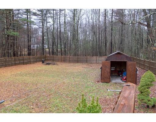 52 Hough Road Sutton, MA 01590 - Photo 22 of 23 a backyard of a house with table and chairs