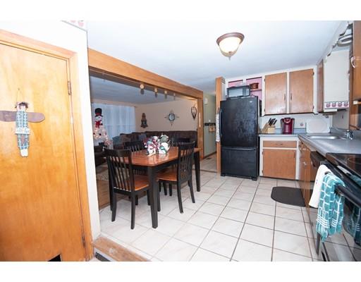 52 Hough Road Sutton, MA 01590 - Photo 5 of 23 a living room with furniture a dining table and a refrigerator