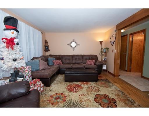 52 Hough Road Sutton, MA 01590 - Photo 10 of 23 a living room with furniture flowerpot and a chandelier
