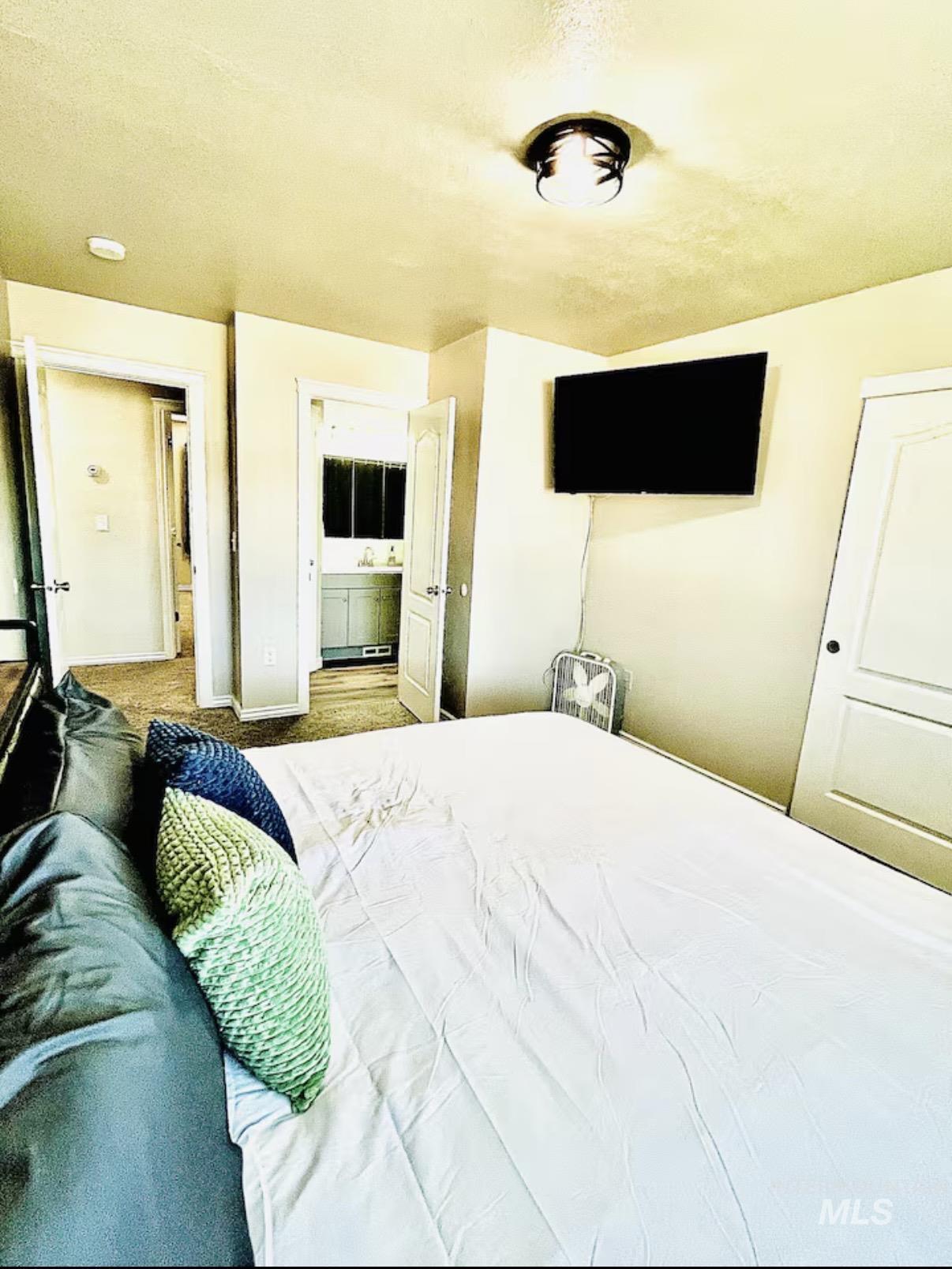 4802-4804 Maid Jessica Street Caldwell, ID 83607 - Photo 14 of 31 Bedroom featuring ensuite bathroom and baseboards