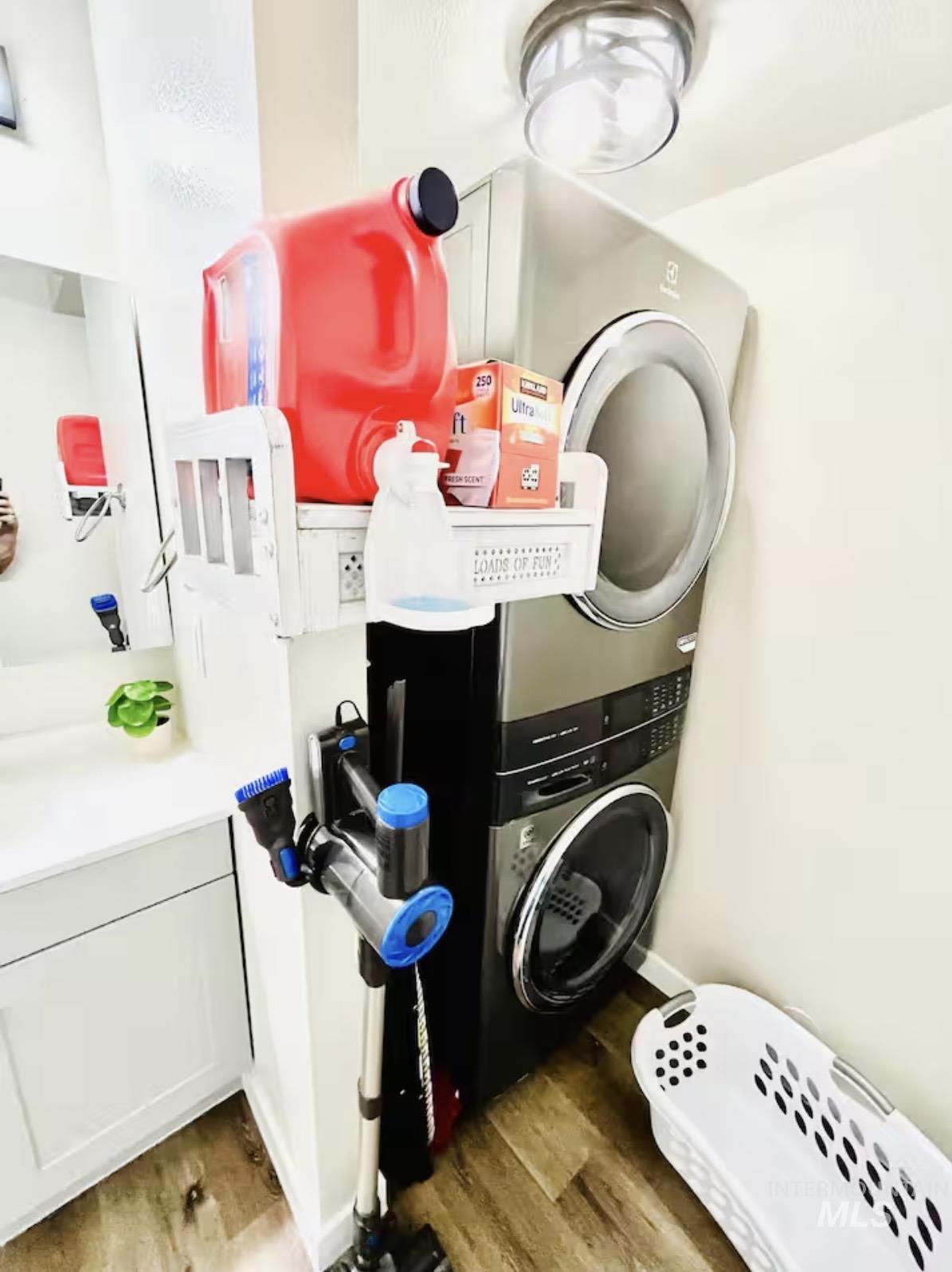4802-4804 Maid Jessica Street Caldwell, ID 83607 - Photo 23 of 31 Washroom with light wood-style floors and estacked washer and dryer