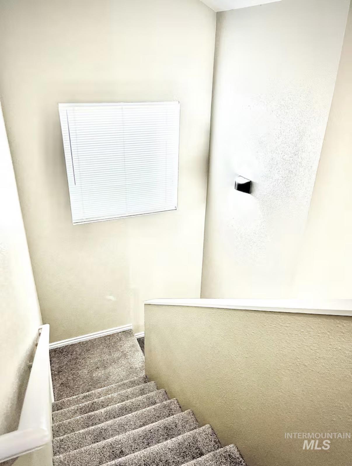 4802-4804 Maid Jessica Street Caldwell, ID 83607 - Photo 24 of 31 Staircase featuring carpet and baseboards