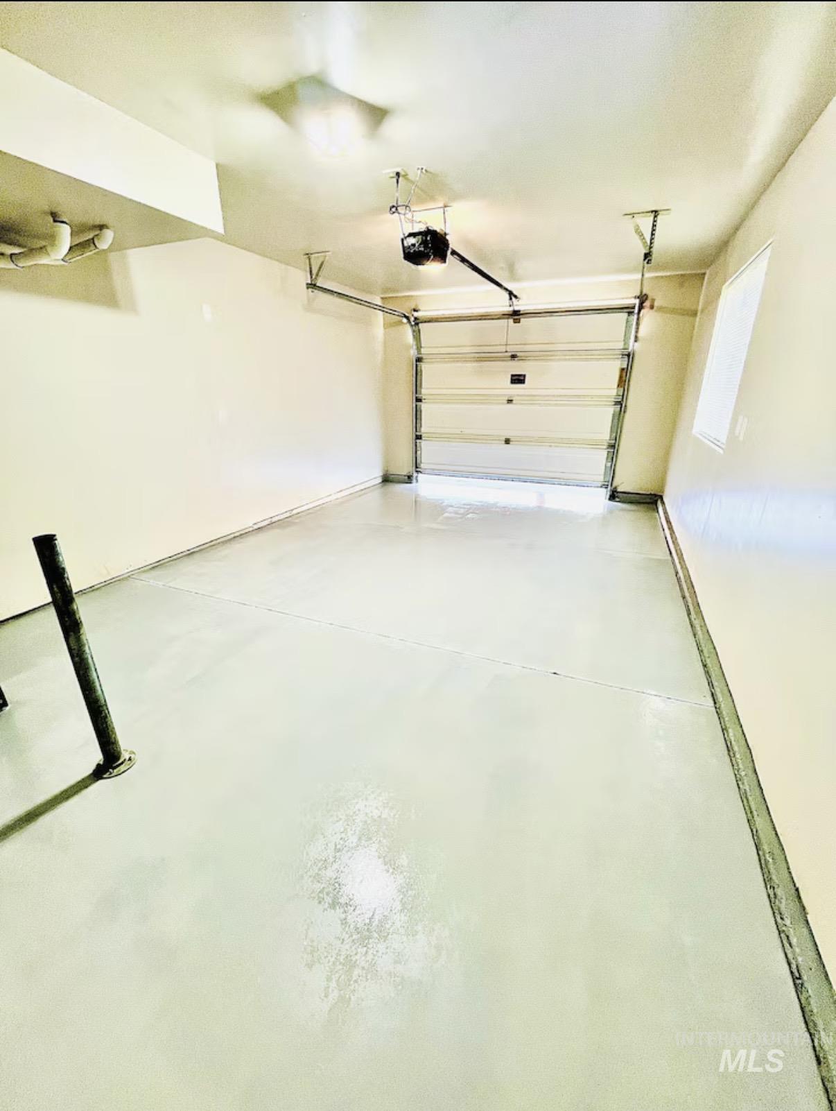 4802-4804 Maid Jessica Street Caldwell, ID 83607 - Photo 25 of 31 Garage featuring a garage door opener