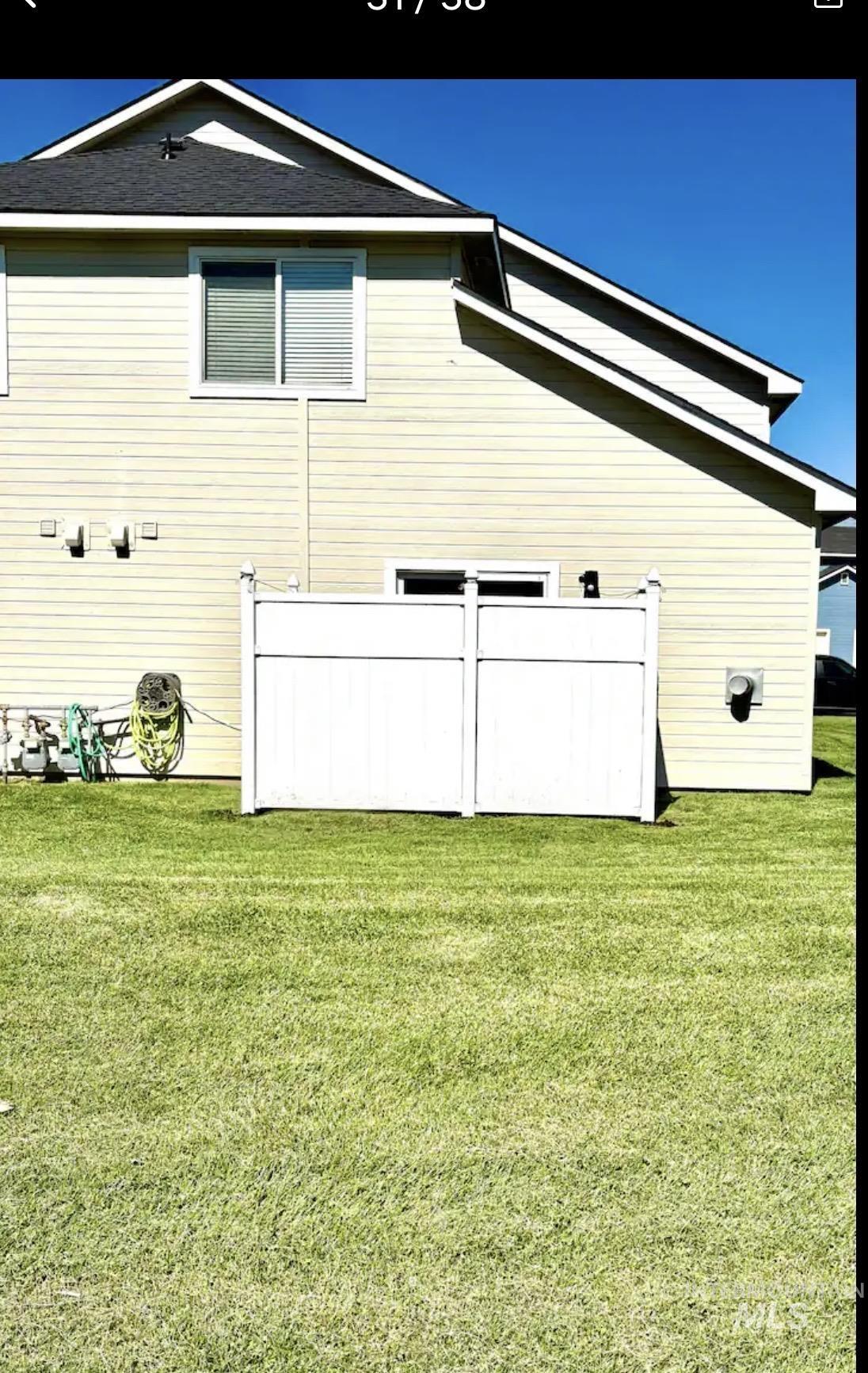 4802-4804 Maid Jessica Street Caldwell, ID 83607 - Photo 4 of 31 Rear view of property with a lawn