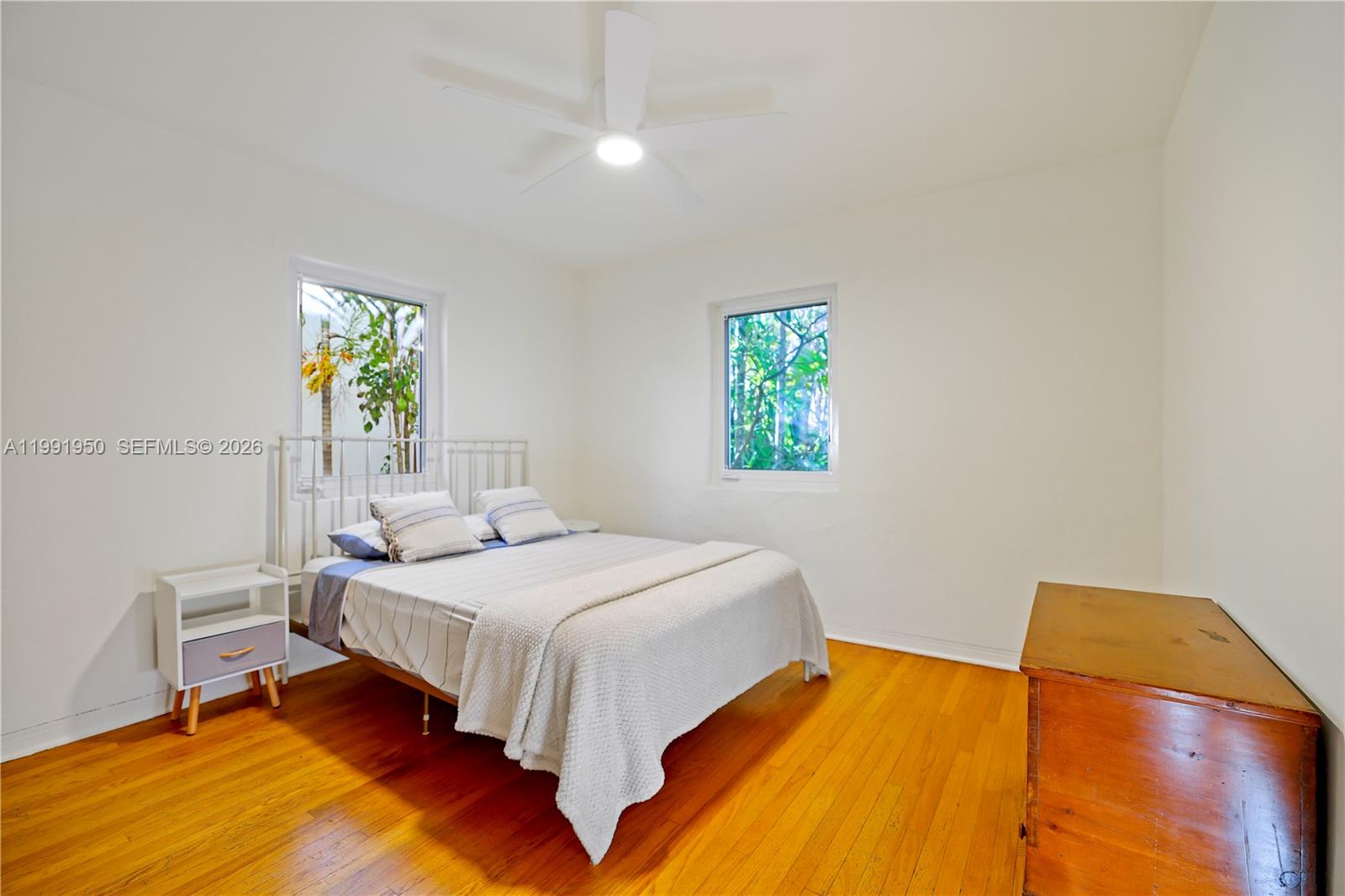 720 Northeast 75th Street Miami, FL 33138 - Photo 11 of 36 a bedroom with a bed and a window
