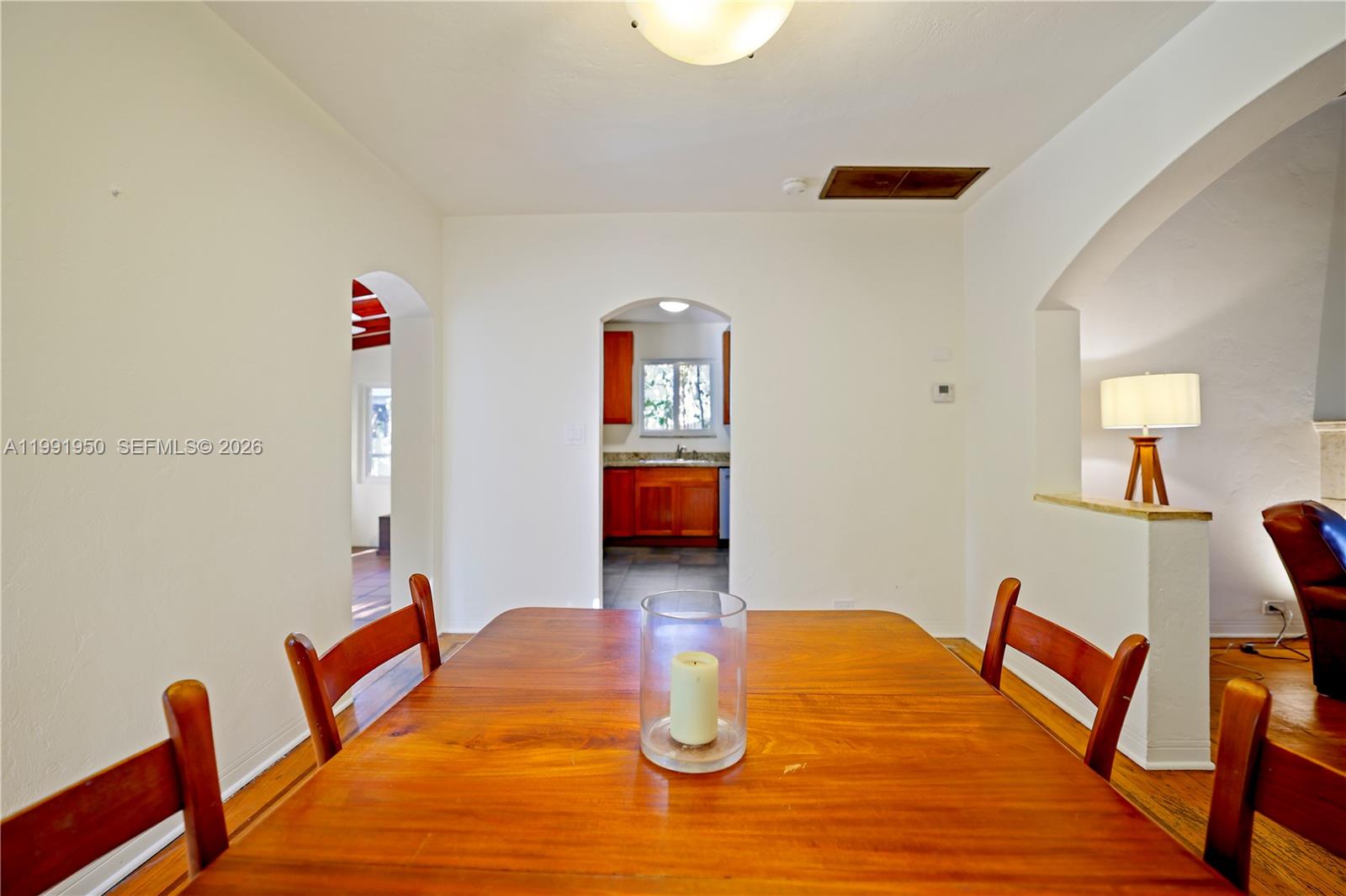 720 Northeast 75th Street Miami, FL 33138 - Photo 14 of 36 a bedroom with furniture and wooden floor