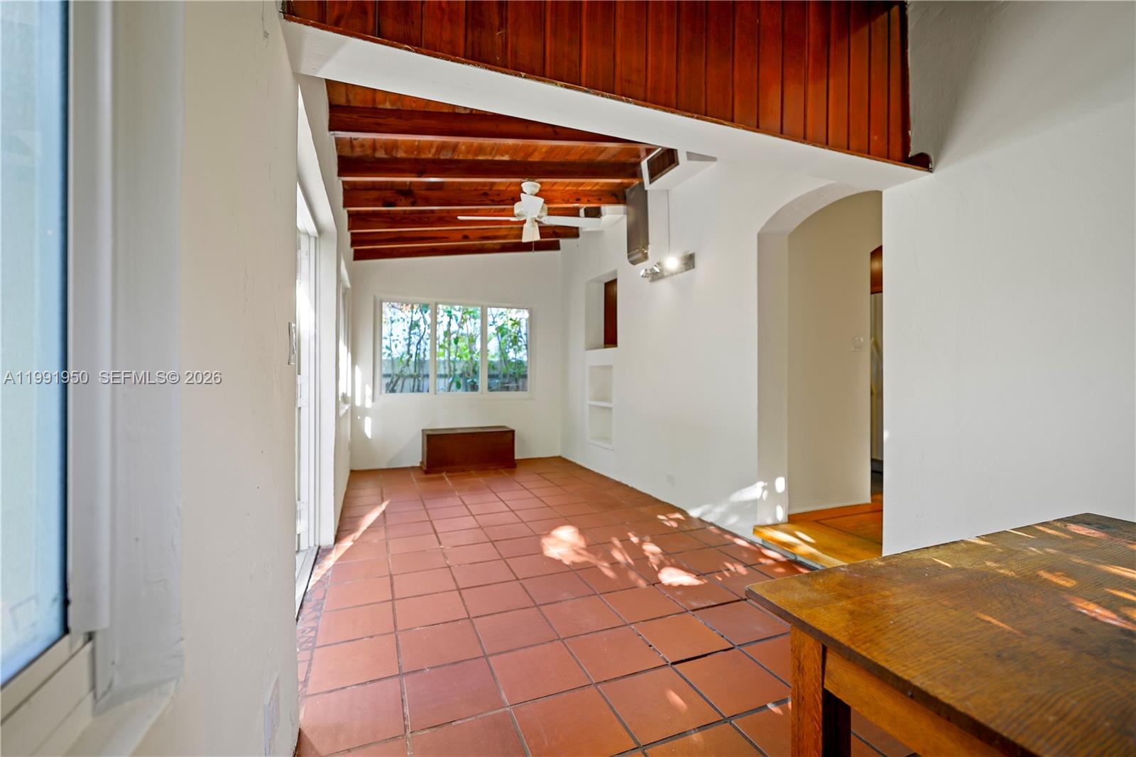 720 Northeast 75th Street Miami, FL 33138 - Photo 22 of 36 a bedroom with a bed and a window
