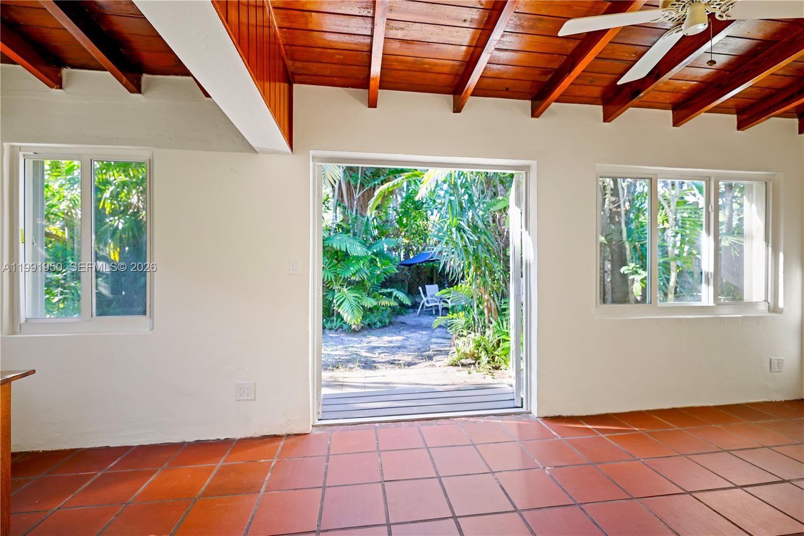 720 Northeast 75th Street Miami, FL 33138 - Photo 23 of 36 a view of an empty room with windows