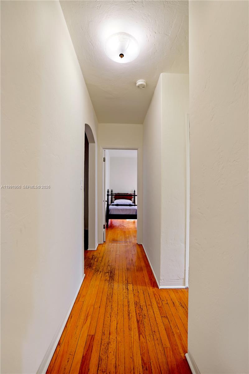 720 Northeast 75th Street Miami, FL 33138 - Photo 25 of 36 a view of a room with wooden floor