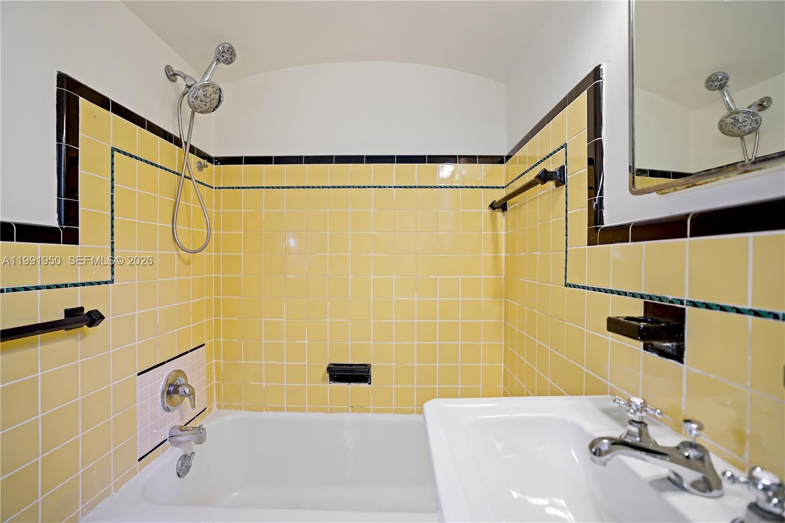 720 Northeast 75th Street Miami, FL 33138 - Photo 31 of 36 a bathroom with a sink and a shower