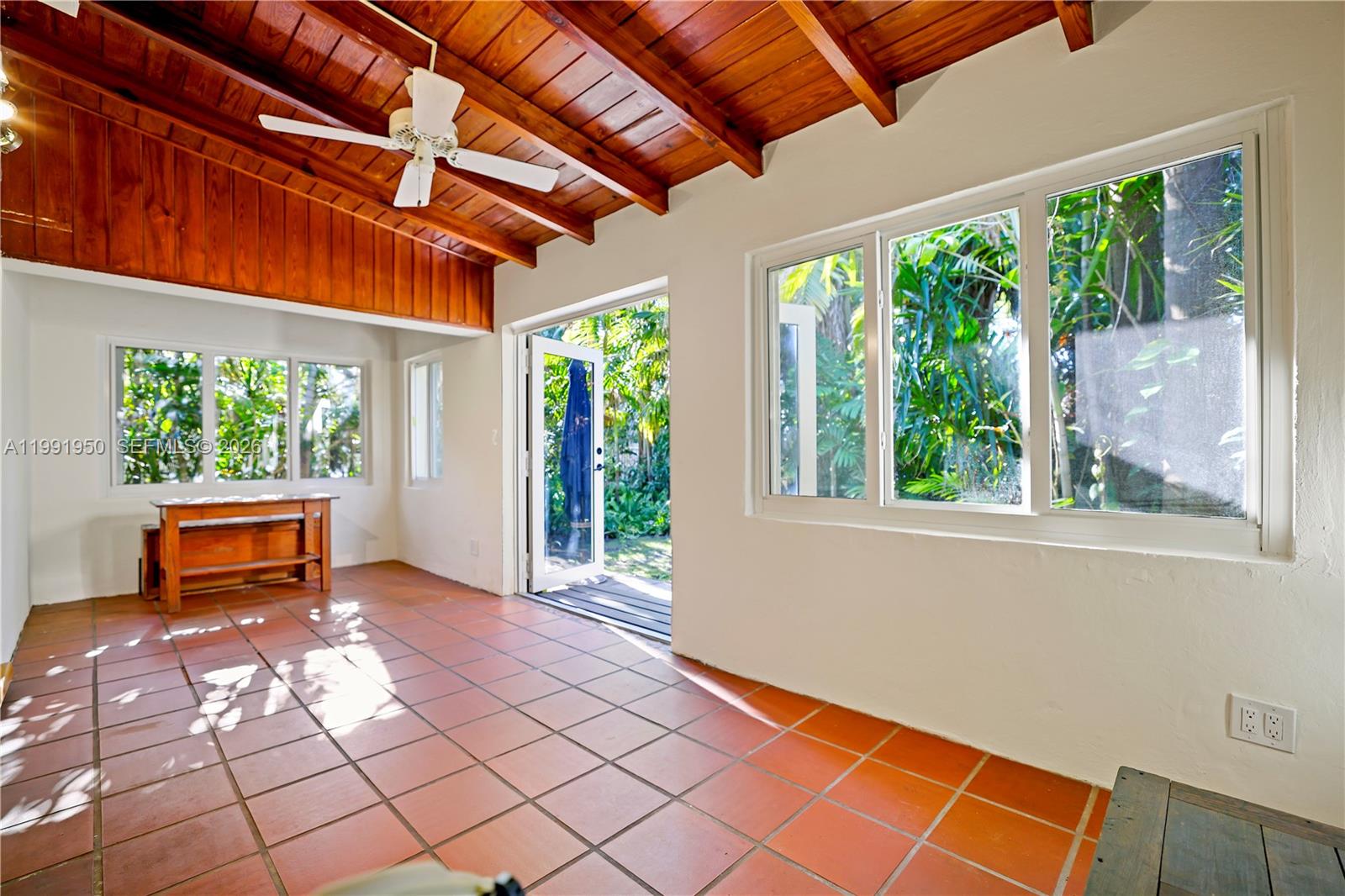 720 Northeast 75th Street Miami, FL 33138 - Photo 4 of 36 a backyard of a house with seating space