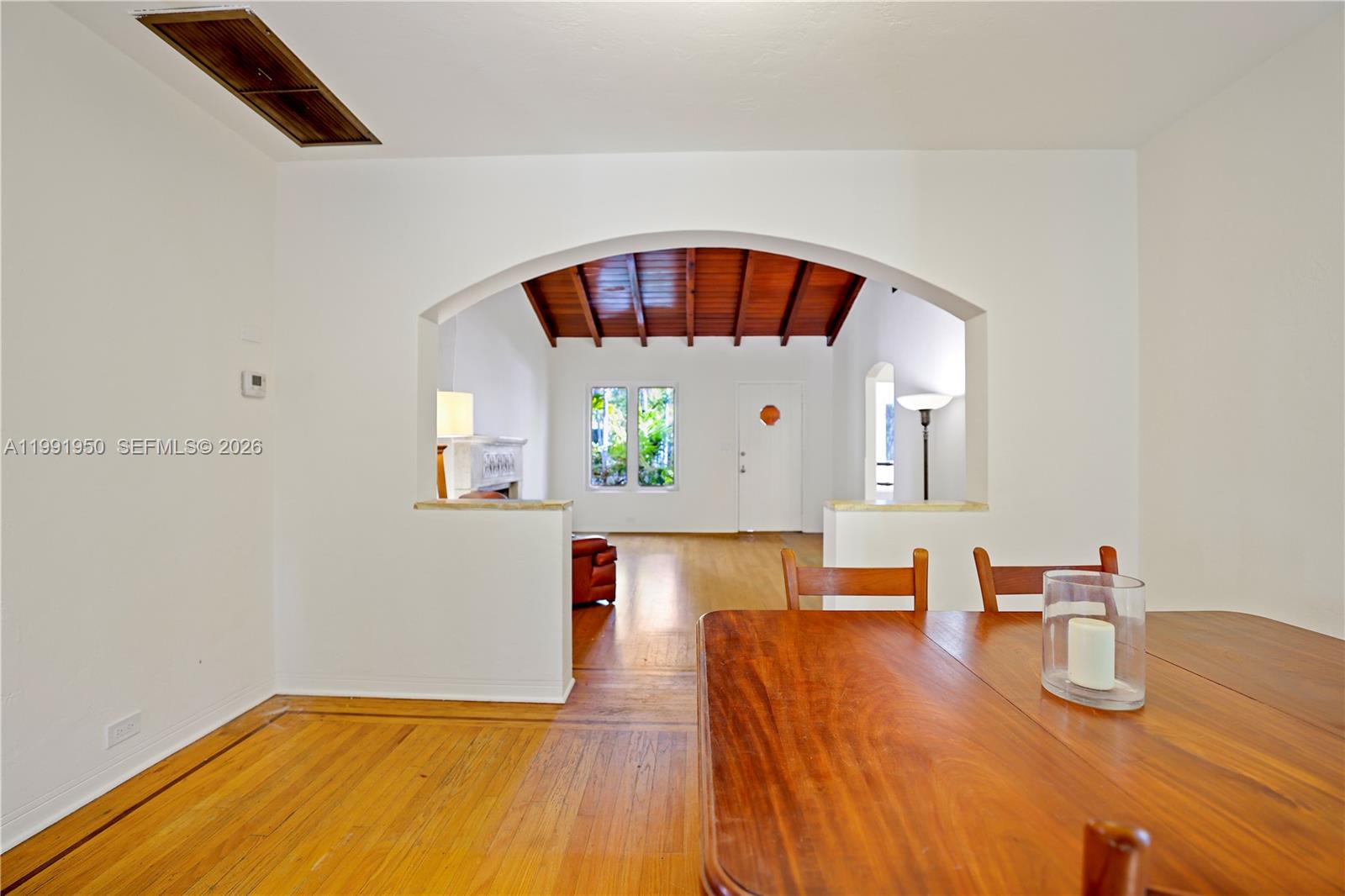 720 Northeast 75th Street Miami, FL 33138 - Photo 5 of 36 a view of kitchen and dining room with wooden floor