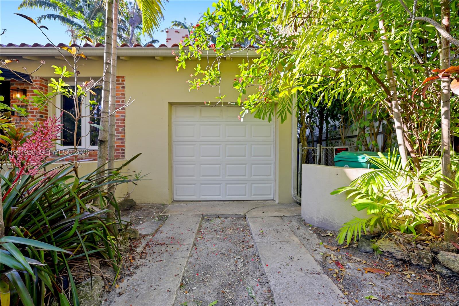 720 Northeast 75th Street Miami, FL 33138 - Photo 7 of 36 a front view of a house with a yard