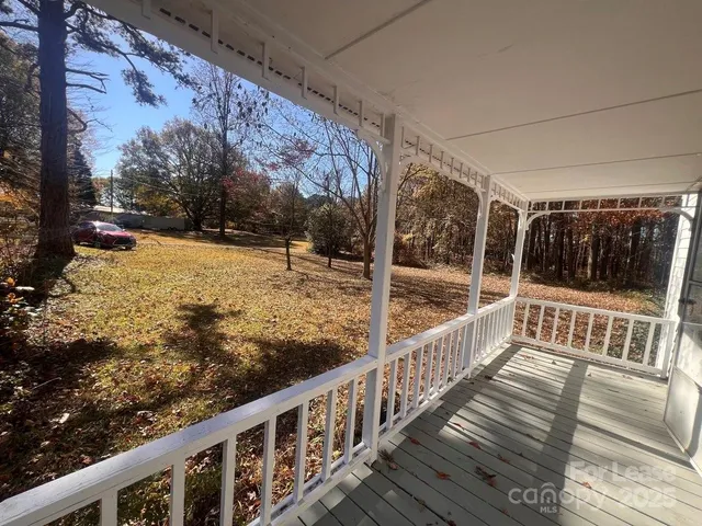 a view of a yard with a tree