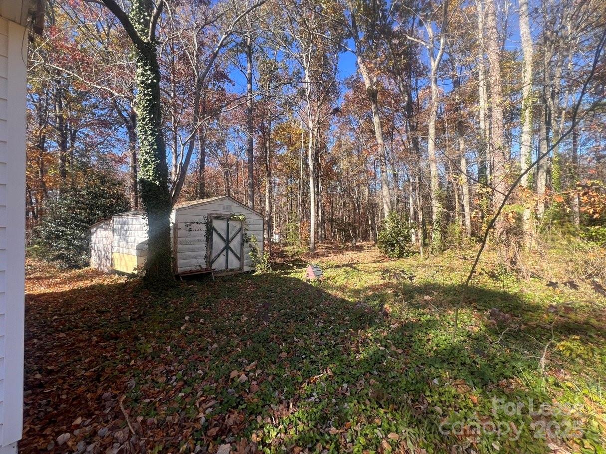 144 Mountain View Road, Unit B Bessemer City, NC 28016 - Photo 19 of 25 a view of a yard with a tree