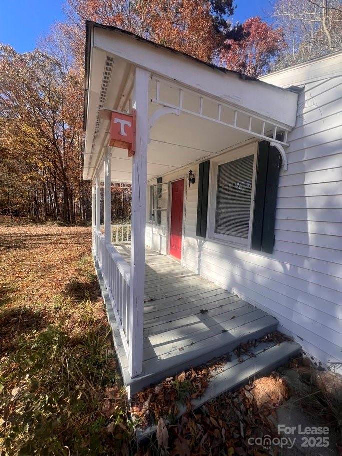 144 Mountain View Road, Unit B Bessemer City, NC 28016 - Photo 20 of 25 a view of a porch with a bench