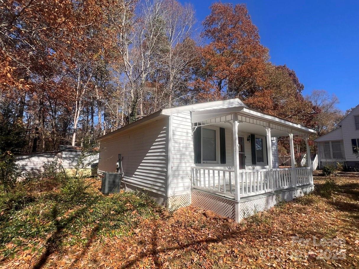 144 Mountain View Road, Unit B Bessemer City, NC 28016 - Photo 22 of 25 a view of a house with a yard