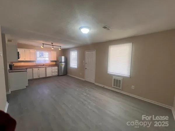 a view of a kitchen with a sink and a window