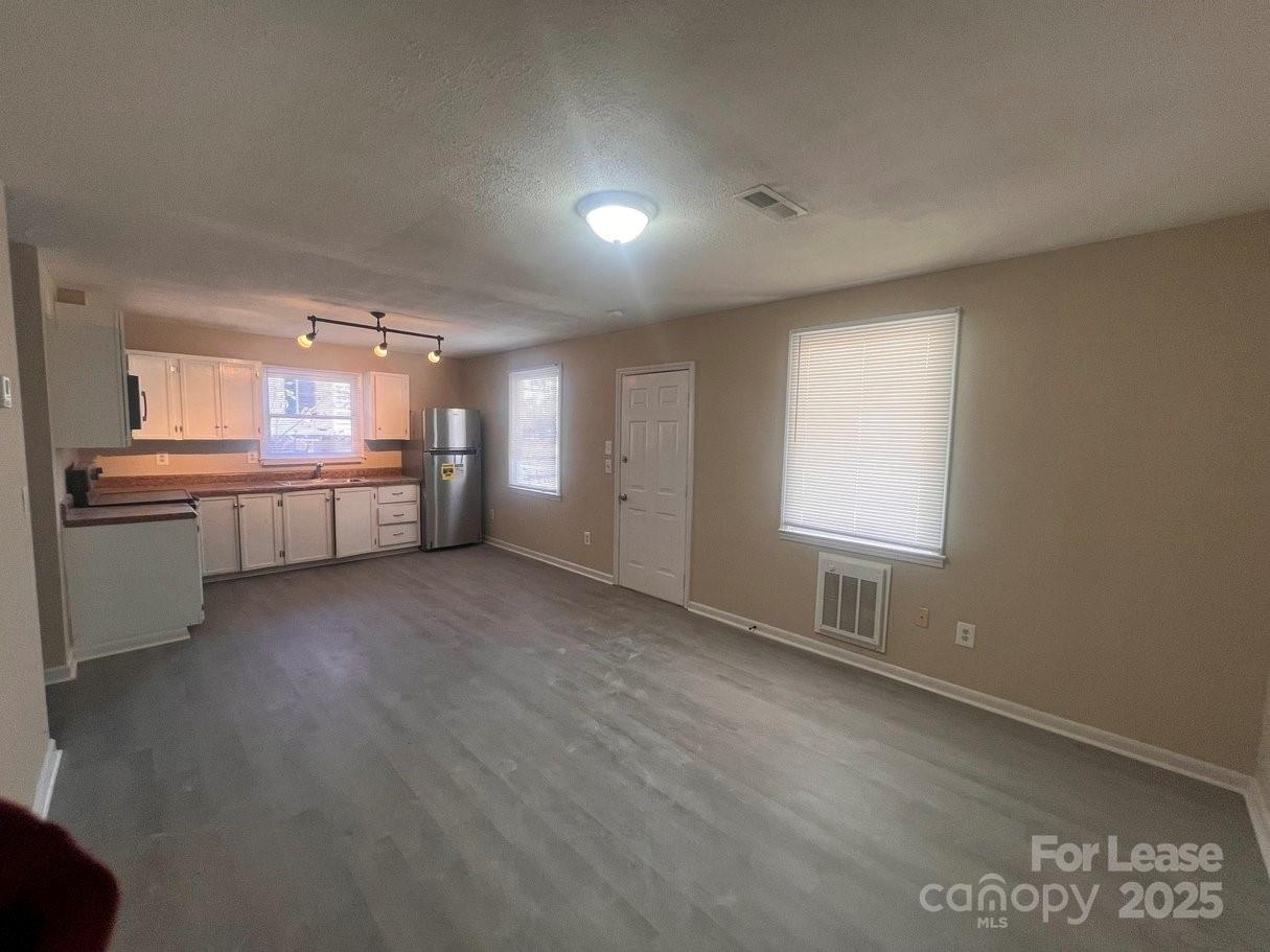 144 Mountain View Road, Unit B Bessemer City, NC 28016 - Photo 4 of 25 a view of a kitchen with a sink and a window