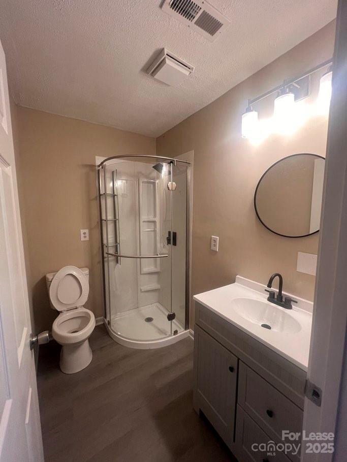 144 Mountain View Road, Unit B Bessemer City, NC 28016 - Photo 8 of 25 a bathroom with a double vanity sink toilet mirror and shower