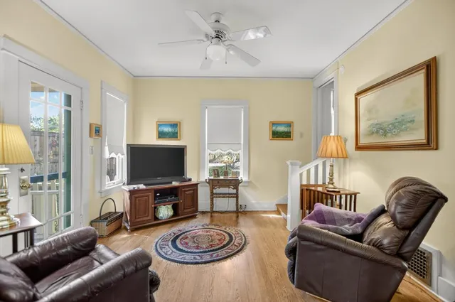 a dining room with furniture a rug and a chandelier