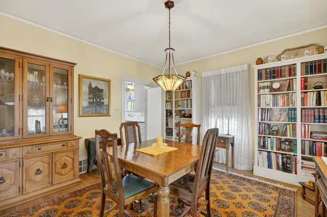 a kitchen with a refrigerator and table in it