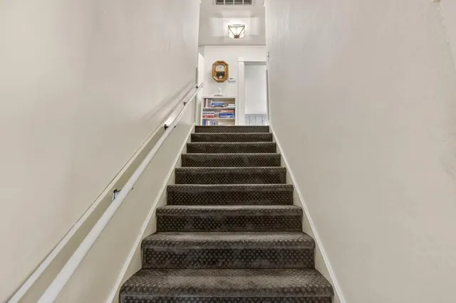 a bedroom with a bed and furniture