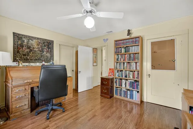 a view of a pathway with flower plants