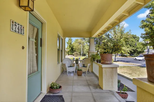 a living room with furniture or couch and a wooden floor