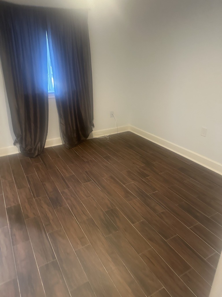 304 Jill Street Conroe, TX 77303 - Photo 15 of 35 a view of wooden floor and brick walls