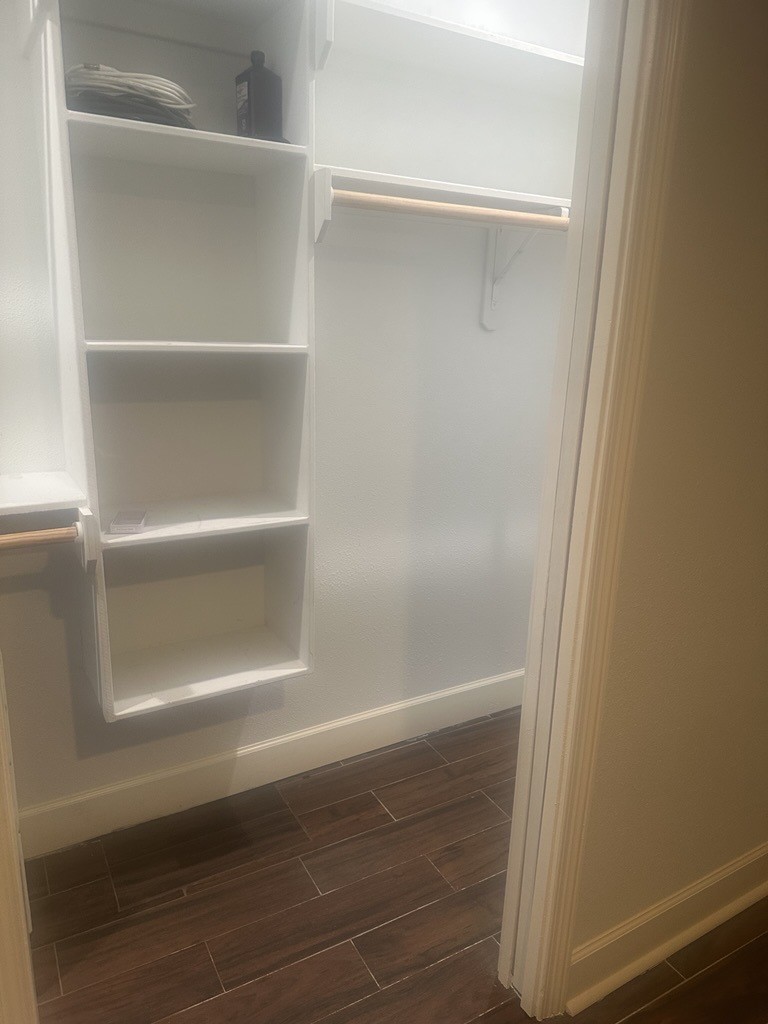 304 Jill Street Conroe, TX 77303 - Photo 16 of 35 a view of walk in closet with empty racks