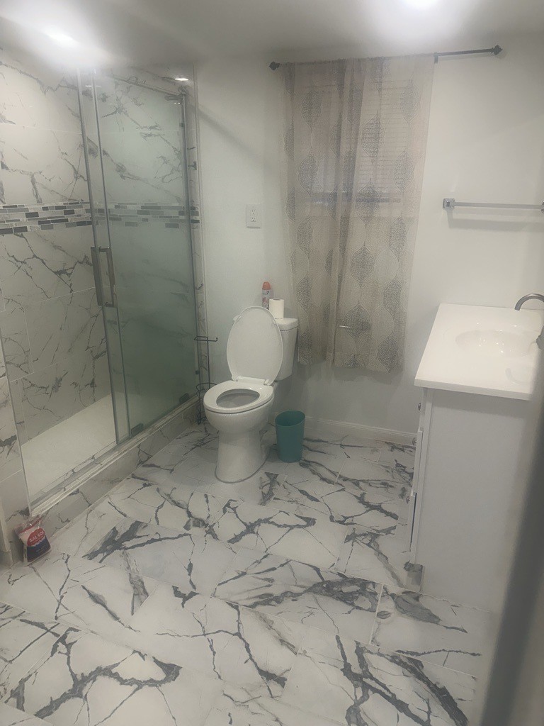 304 Jill Street Conroe, TX 77303 - Photo 20 of 35 a bathroom with a toilet and a shower