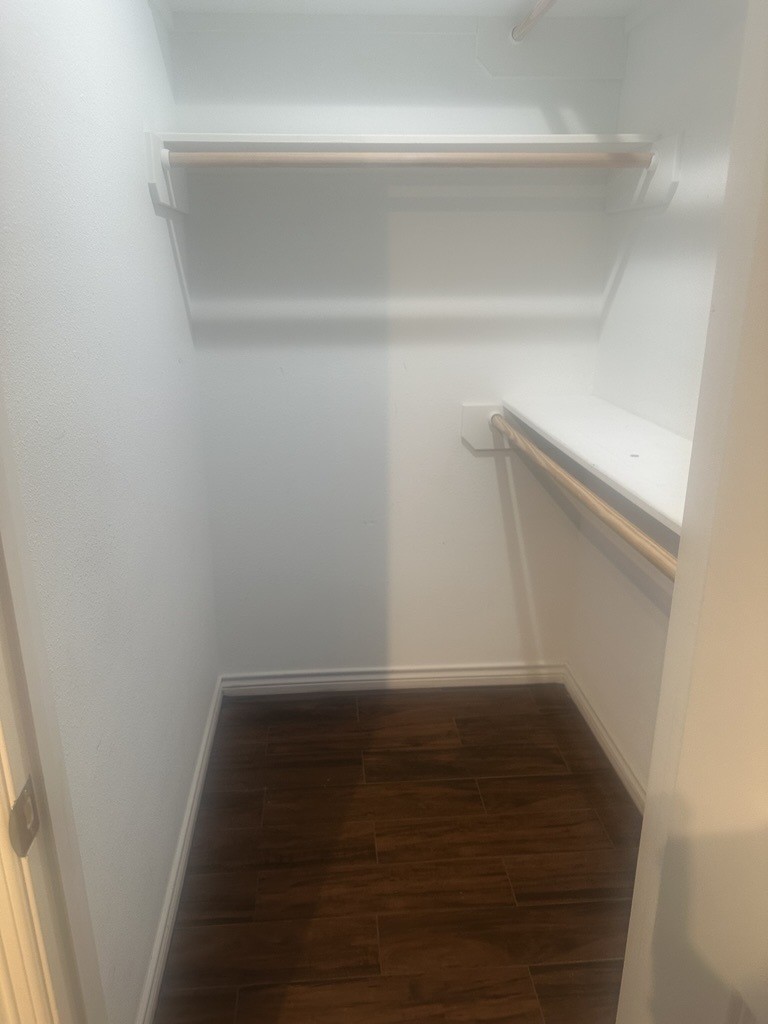 304 Jill Street Conroe, TX 77303 - Photo 22 of 35 a view of a room with wooden floor
