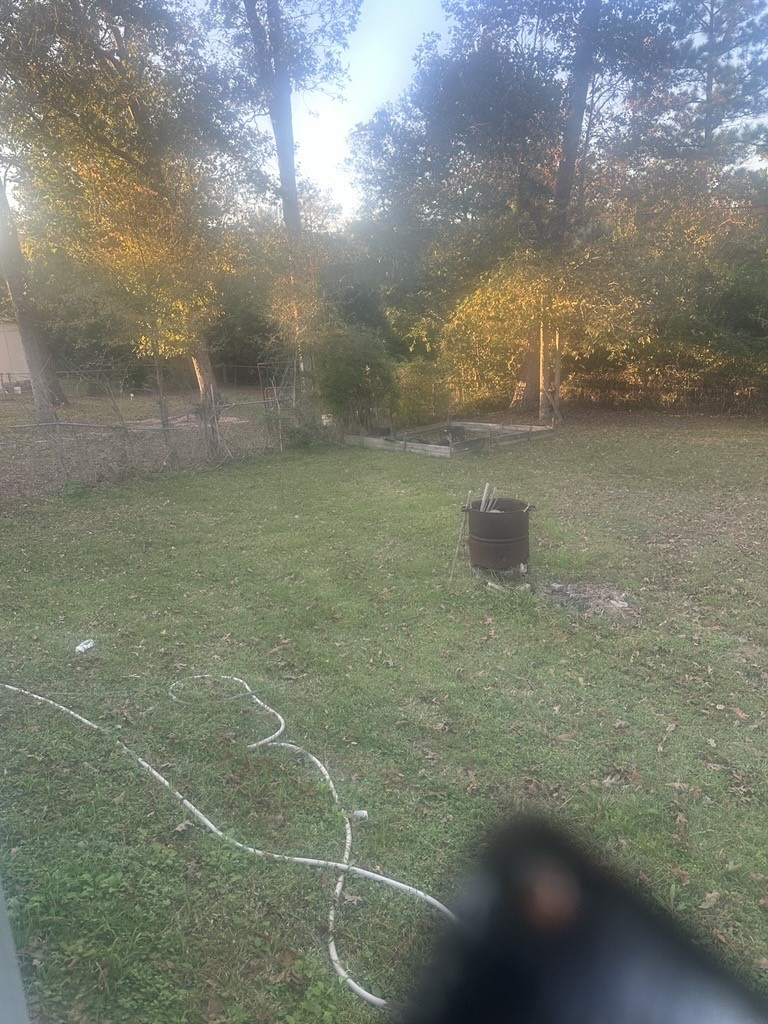 304 Jill Street Conroe, TX 77303 - Photo 25 of 35 a view of a yard