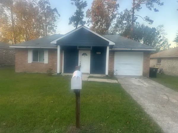 a brick house with a yard
