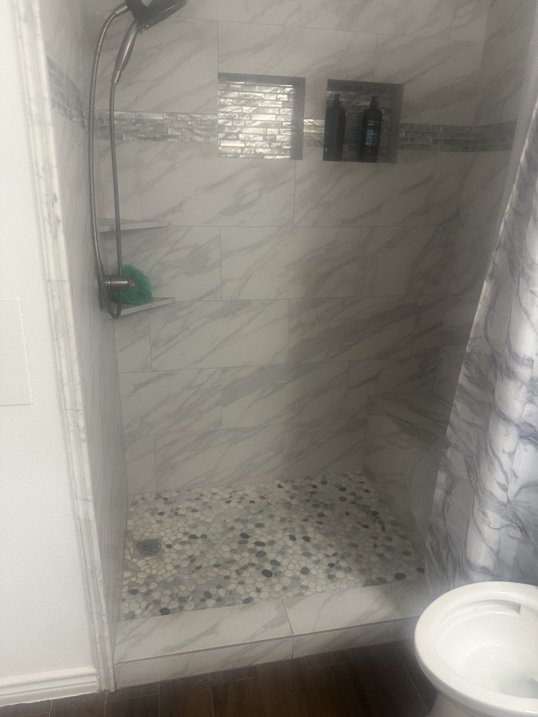 304 Jill Street Conroe, TX 77303 - Photo 4 of 35 a bathroom with a shower